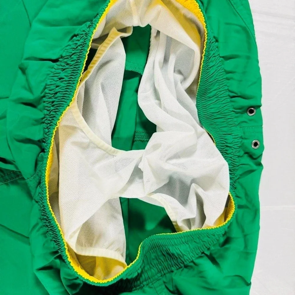 Polo Ralph Lauren green swim trunks with yellow trim.